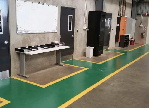 Durable safety lines on a factory floor.